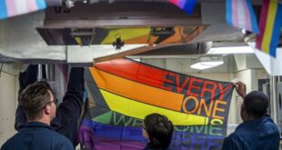 Sailors decorate the mess decks in observance of Pride month